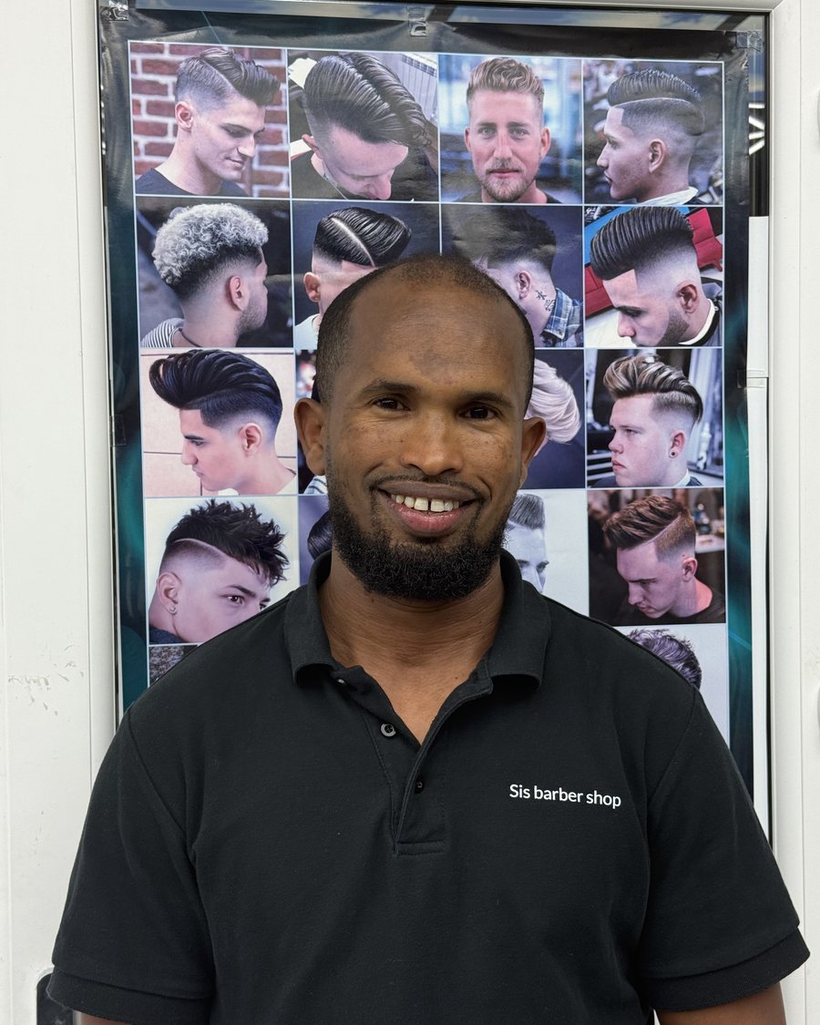 Sis, lead barber at Sis Barber Shop in Walsall